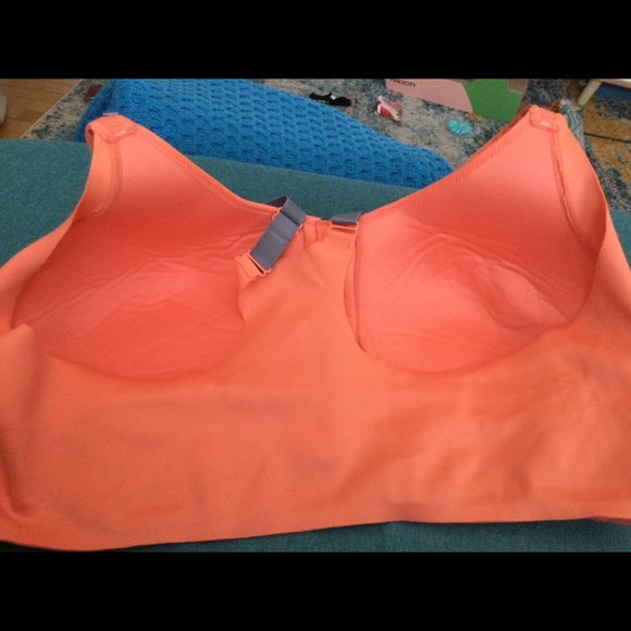 This bra was never worn. It is bright orange with adjustable straps. - Picture 3 of 3